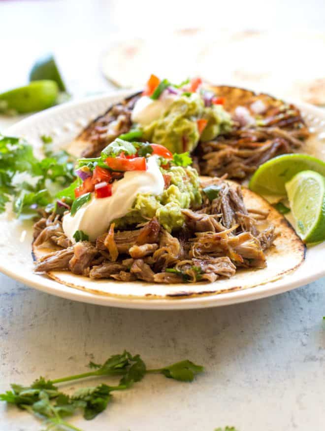 carnitas with sour cream and guacamole