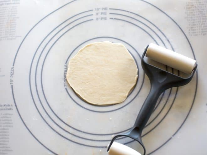tortilla dough being rolled out