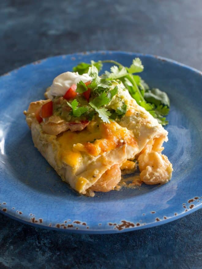 shrimp enchiladas on a blue plate