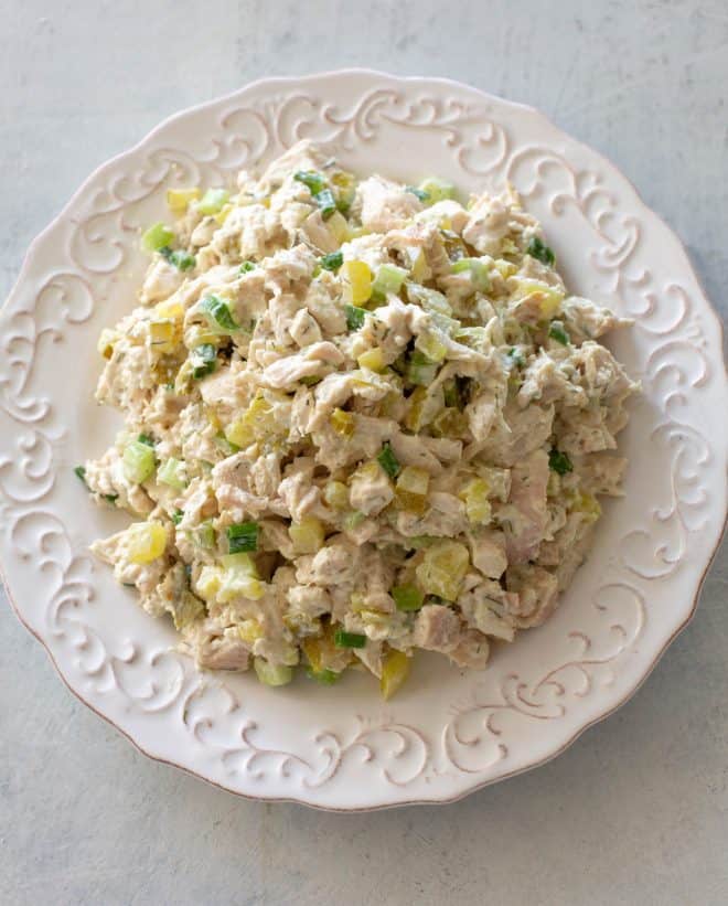 chicken salad with celery on a white plate.