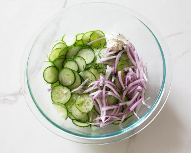cucumber and red onion in a bowl