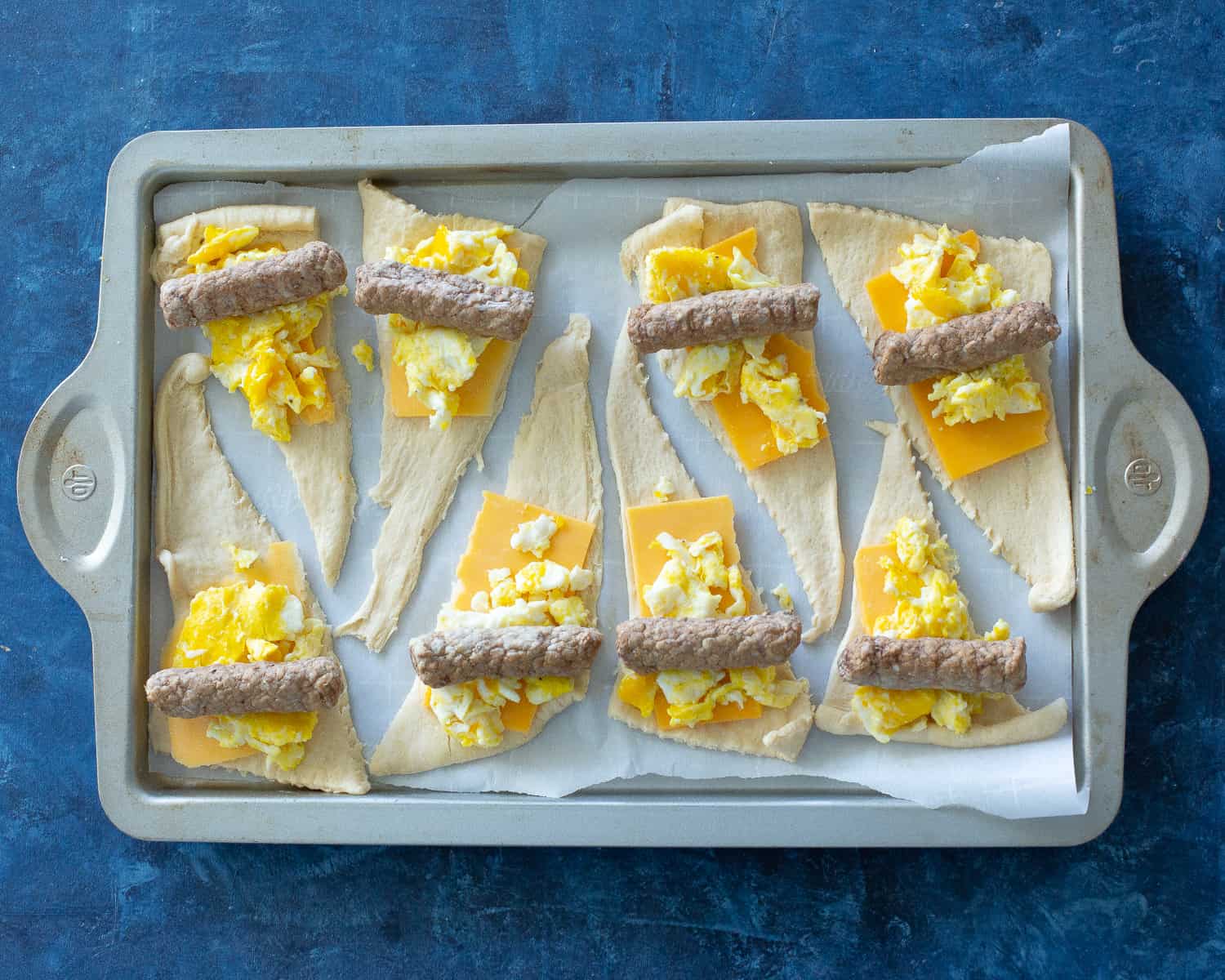 egg, cheese, and sausage in a crescent roll
