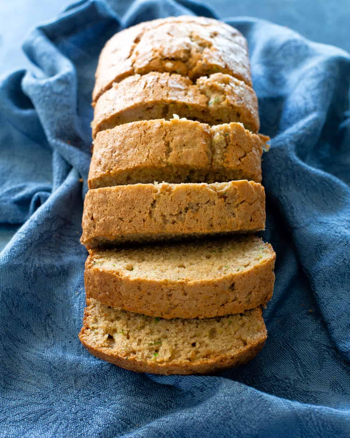 slices of zucchini bread on a blue napkin
