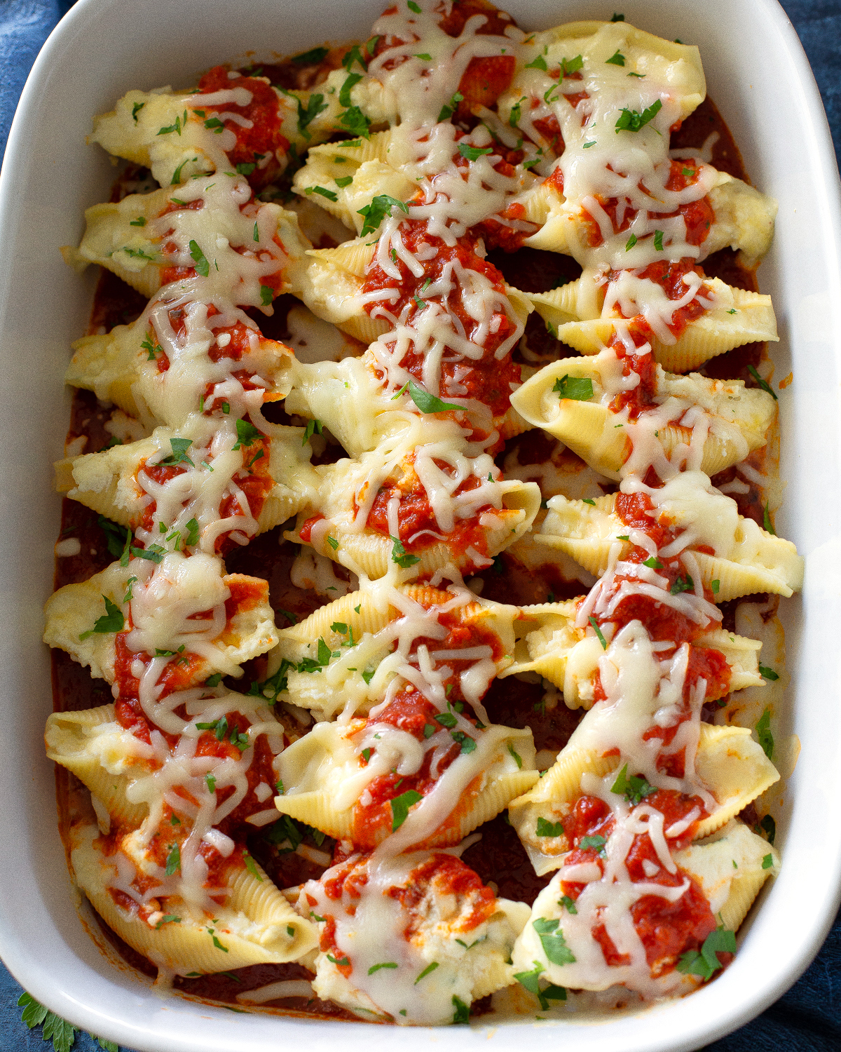 stuffed shells with marinara on top