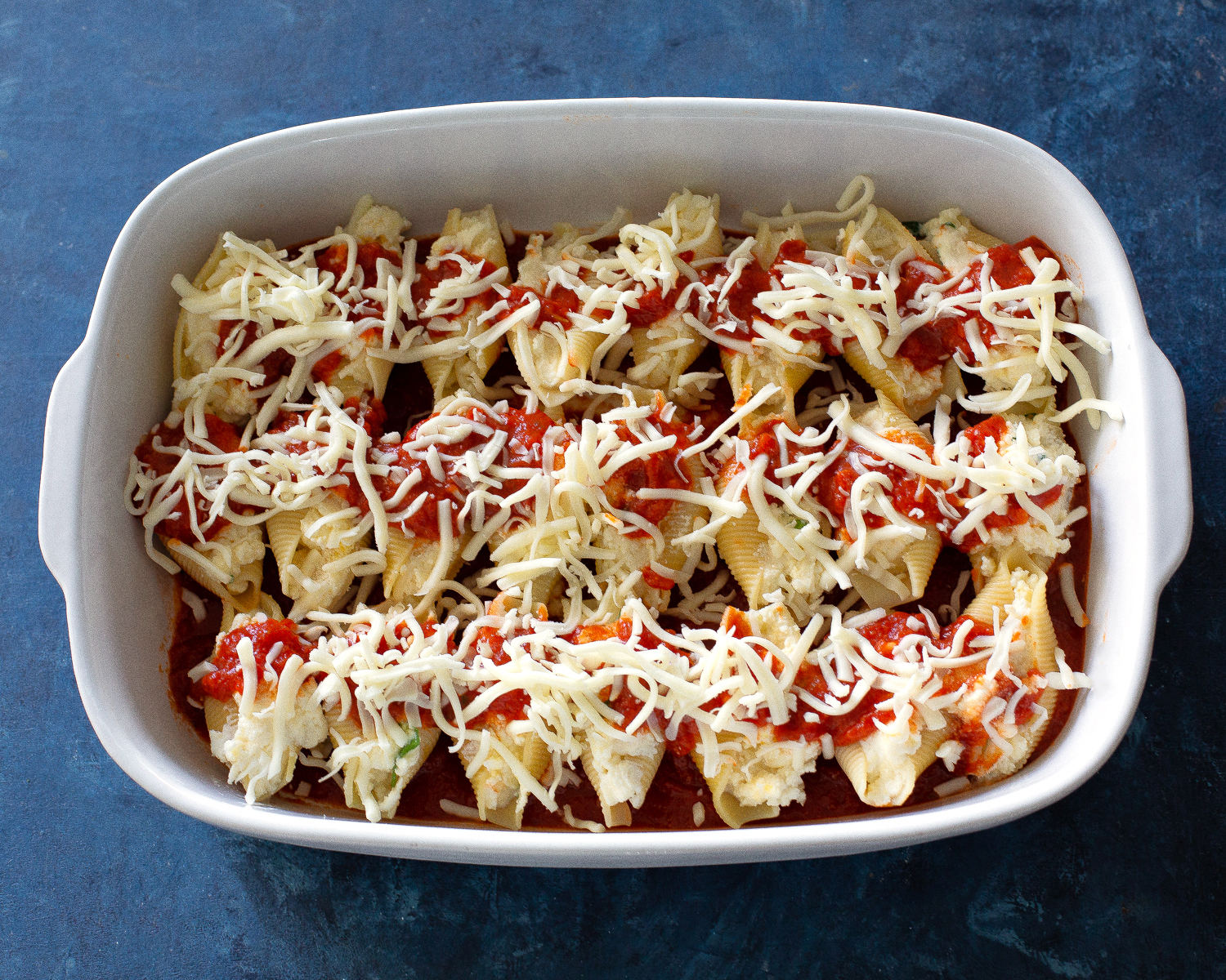 stuffed shells with marinara on top