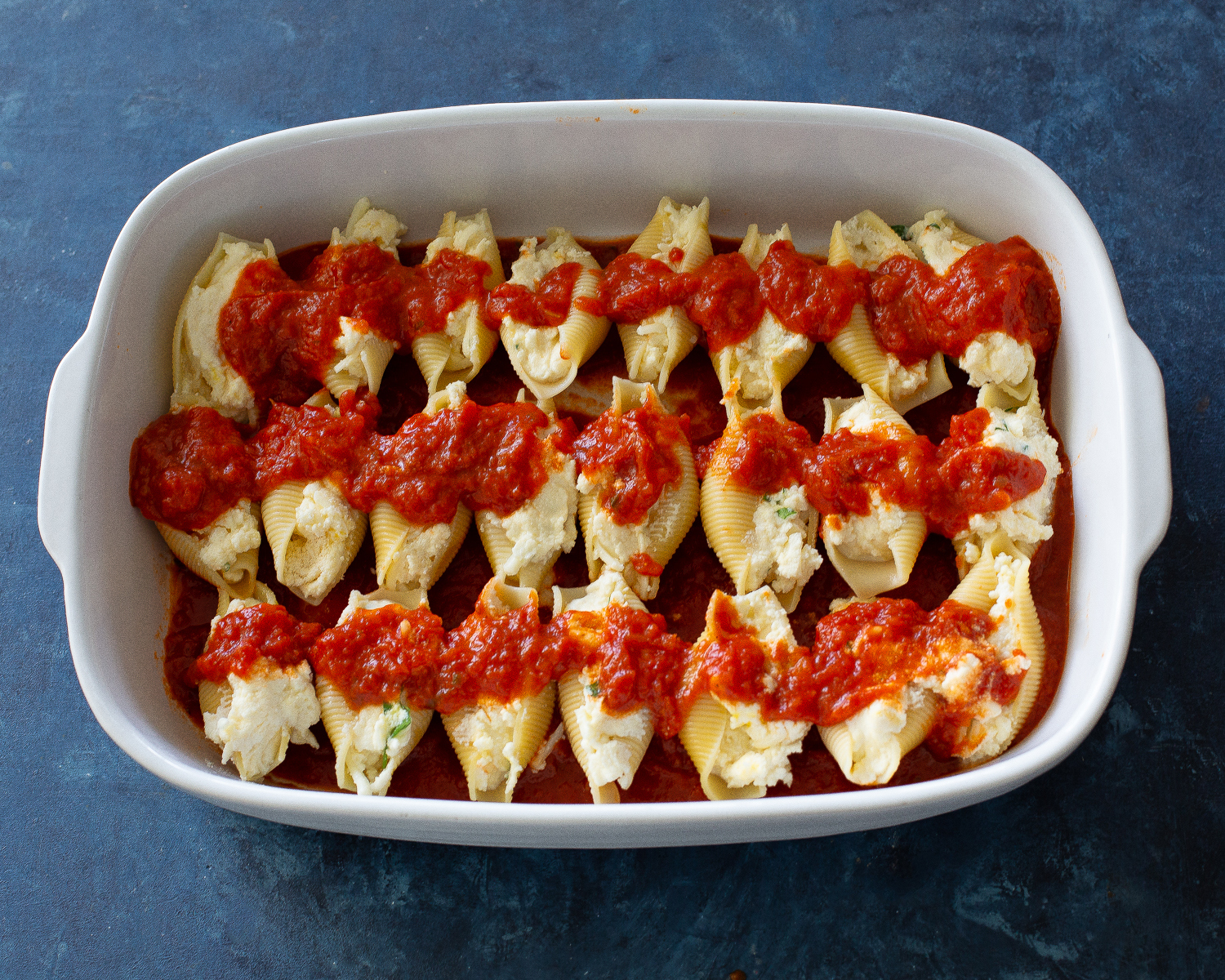 stuffed shells with marinara on top