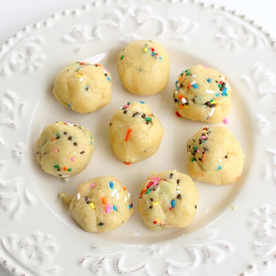 Cake Batter Truffles - cake batter flavored edible dough dipped in vanilla coating and lots and lots of sprinkles. the-girl-who-ate-everything.com