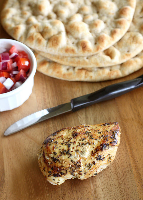 Chicken Gyros - Greek marinated chicken recipe topped with fresh tzatziki sauce. the-girl-who-ate-everything.com