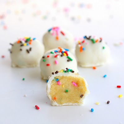 Cake Batter Truffles - cake batter flavored edible dough dipped in vanilla coating and lots and lots of sprinkles. the-girl-who-ate-everything.com