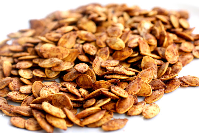 Roasted Pumpkin Seeds are easier than you think. If you've ever wanted to know how to roast pumpkin seeds, I'll teach you. This roasted pumpkin seeds recipe are crispy and full of seasoning! #pumpkin #seeds the-girl-who-ate-everything.com